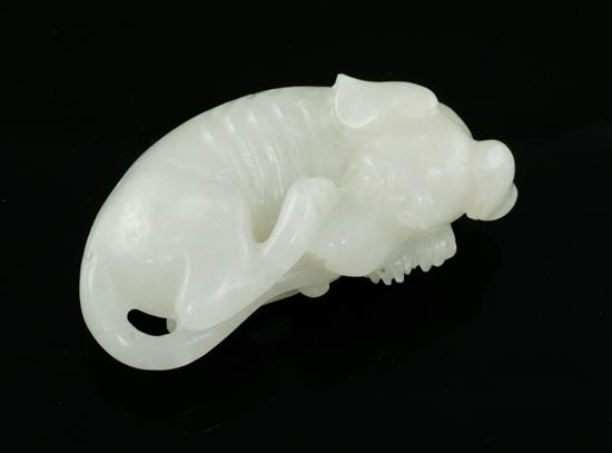 A Chinese white jade figure of a recumbent hound, 20th century, 5cm